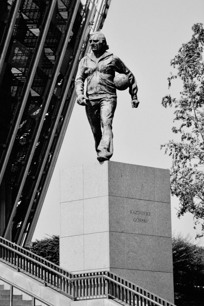 pexels photo 28301099 28301099 Black and white image of Kazimierz Górski statue outside stadium in Warsaw.